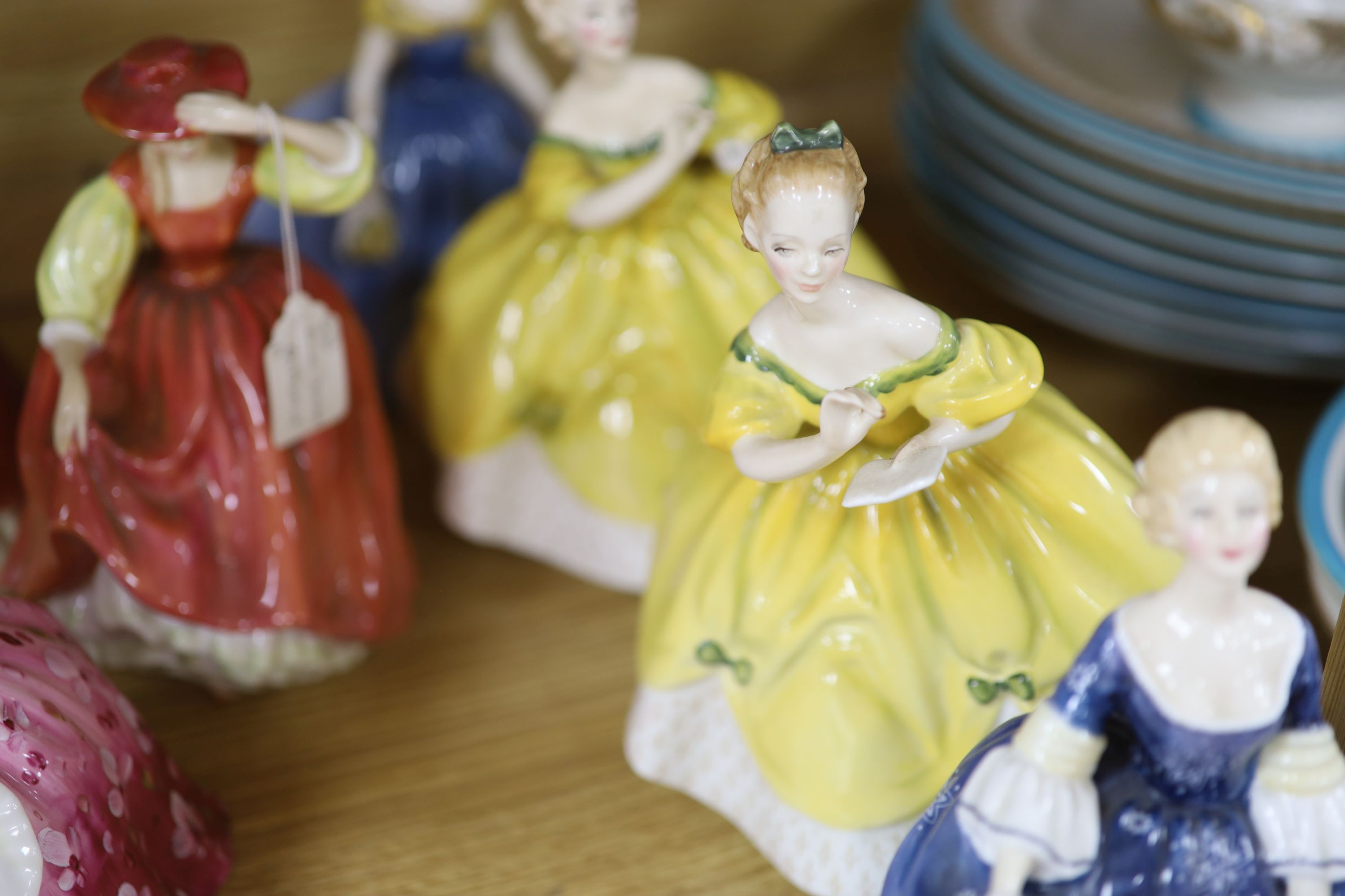 A collection of fourteen Royal Doulton figures